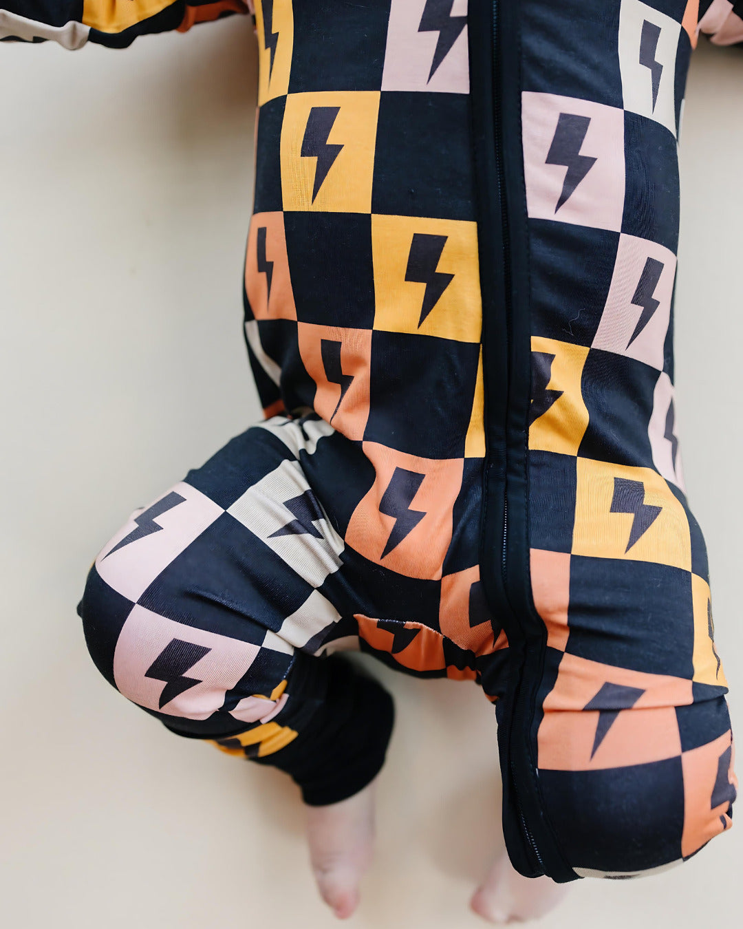 Colorful Checks & Bolts Bamboo Zip Romper